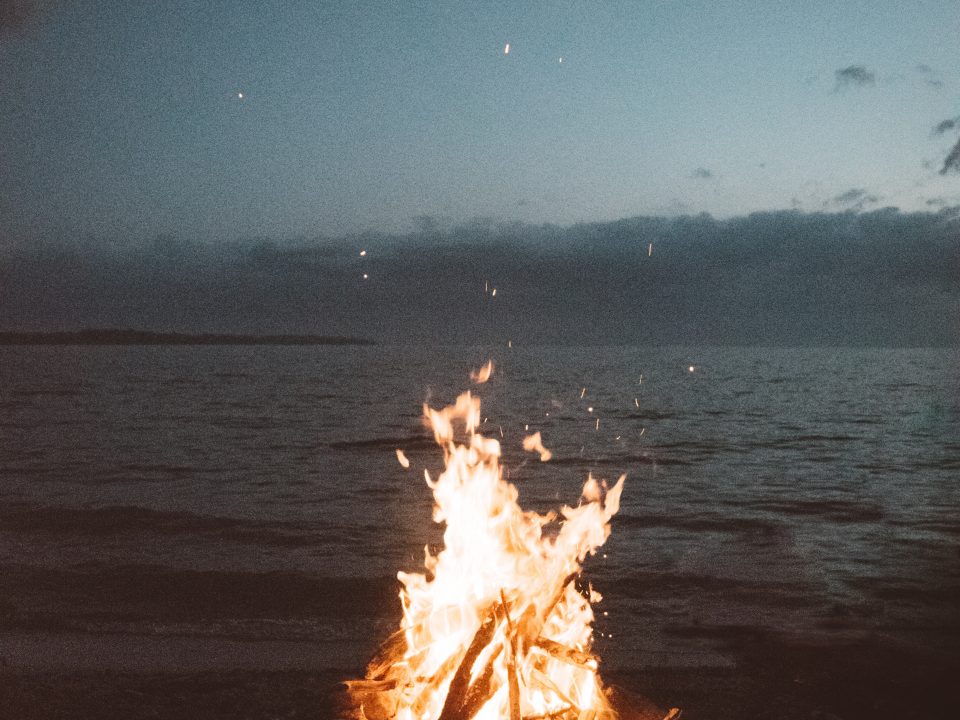 bonfire near seashore during nighttime