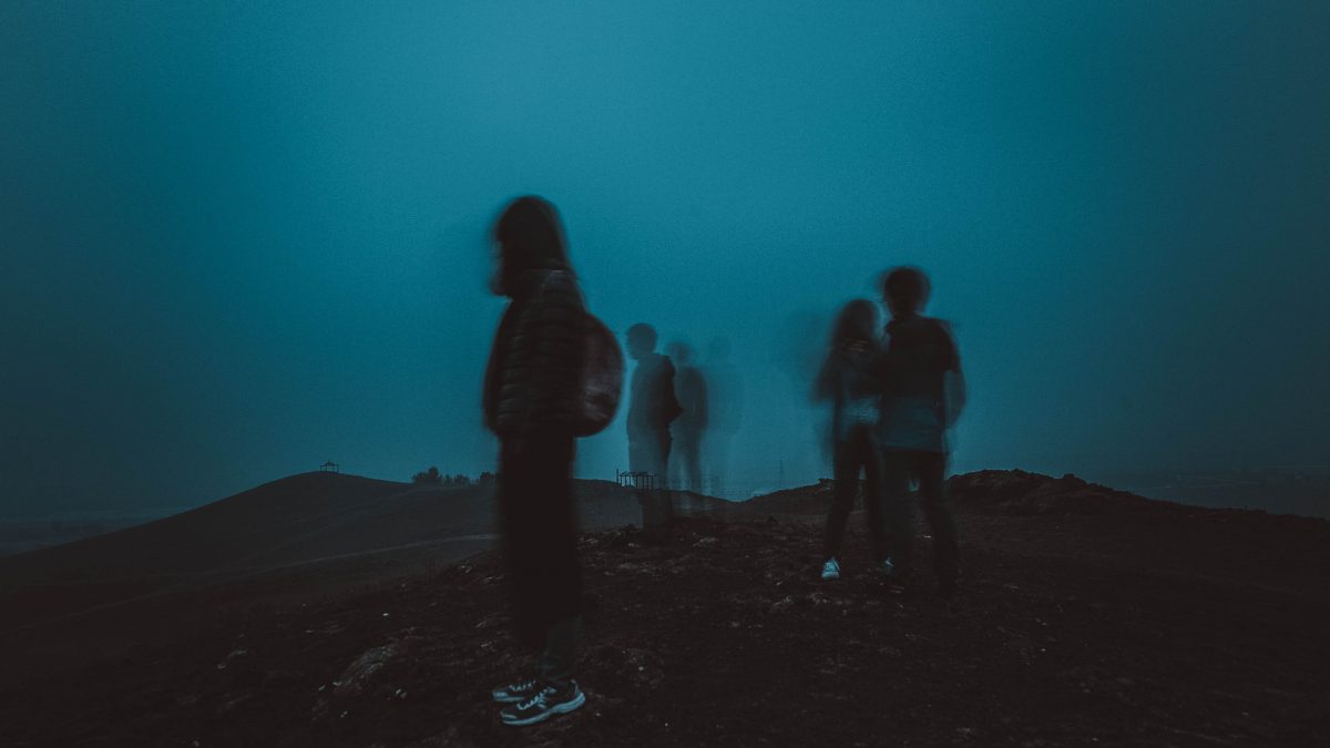 people standing on mountain