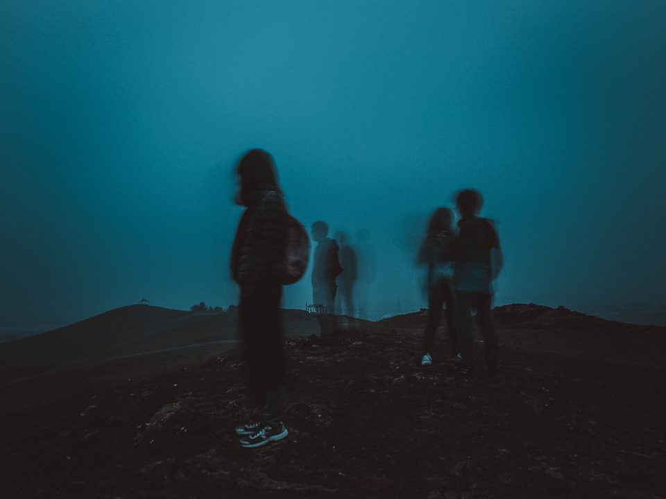 people standing on mountain