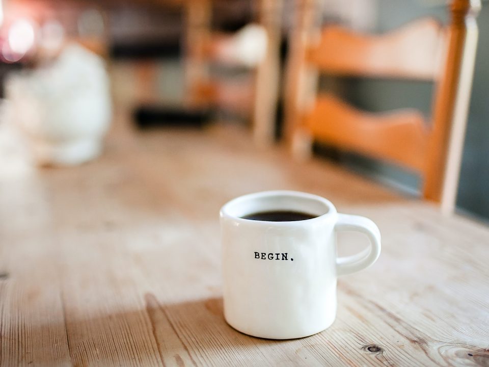 white ceramic mug on table