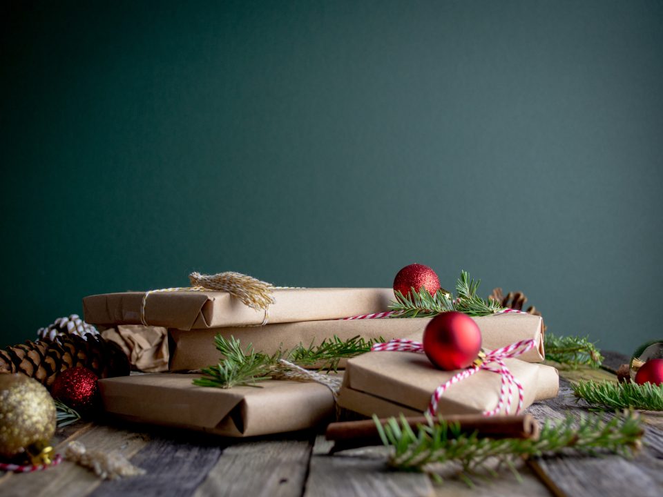 gift boxes with red baubles on top