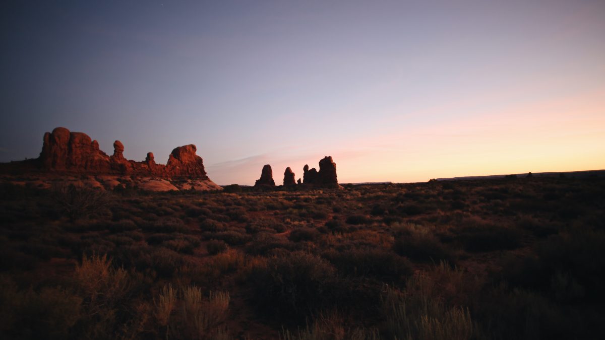brown rock formation during sunset