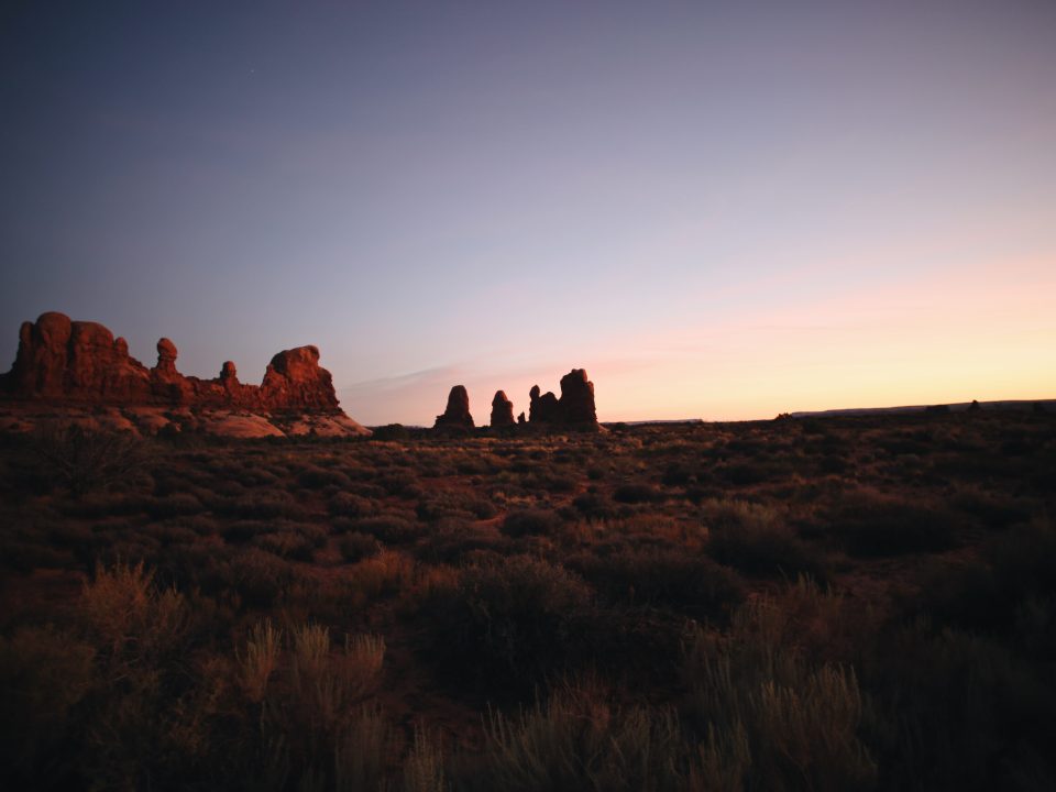 brown rock formation during sunset