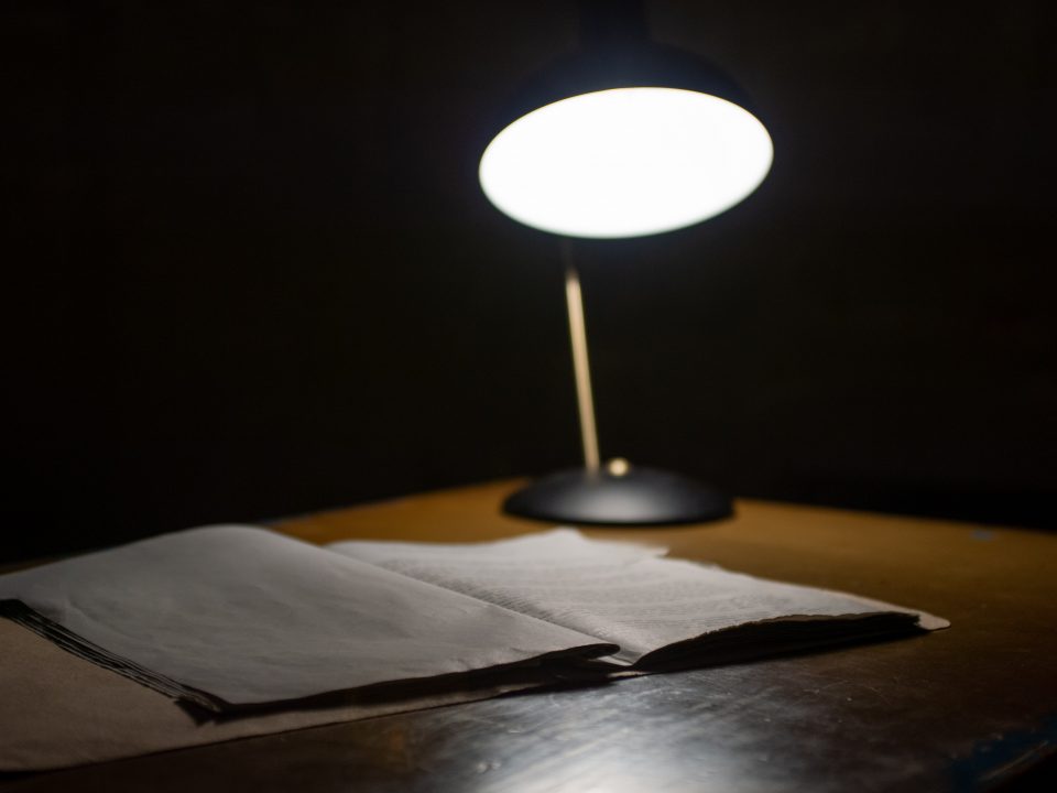 black table lamp beside book