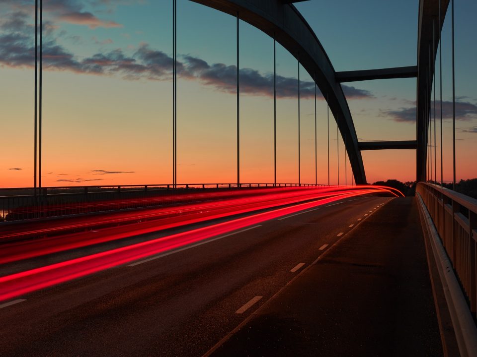 time lapse photo of cable bridge during golden hour