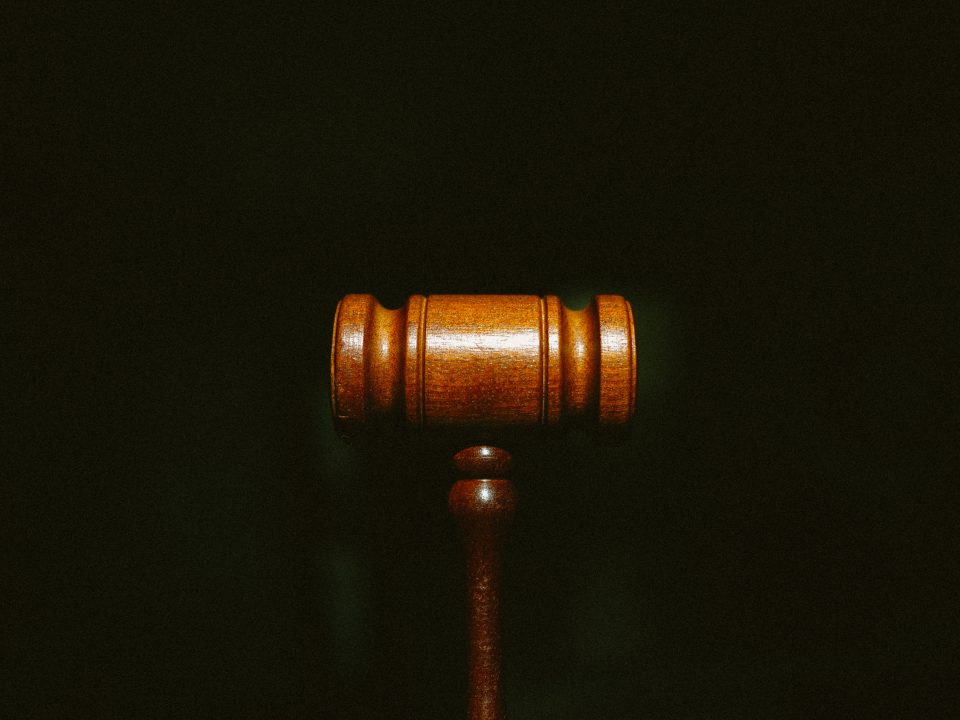 brown wooden stand with black background