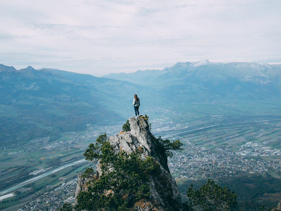 person standing on top of mountain