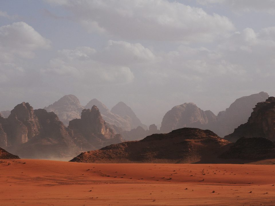 mountains under white clouds at daytime