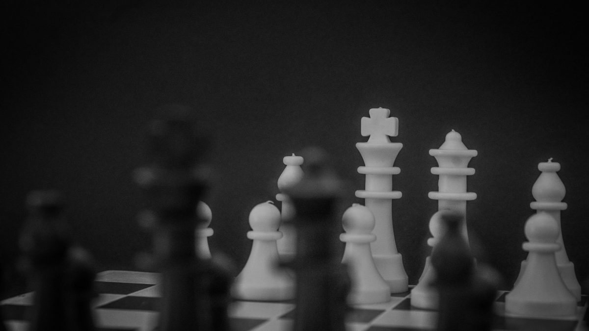 grayscale photo of a chess set
