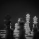 grayscale photo of a chess set