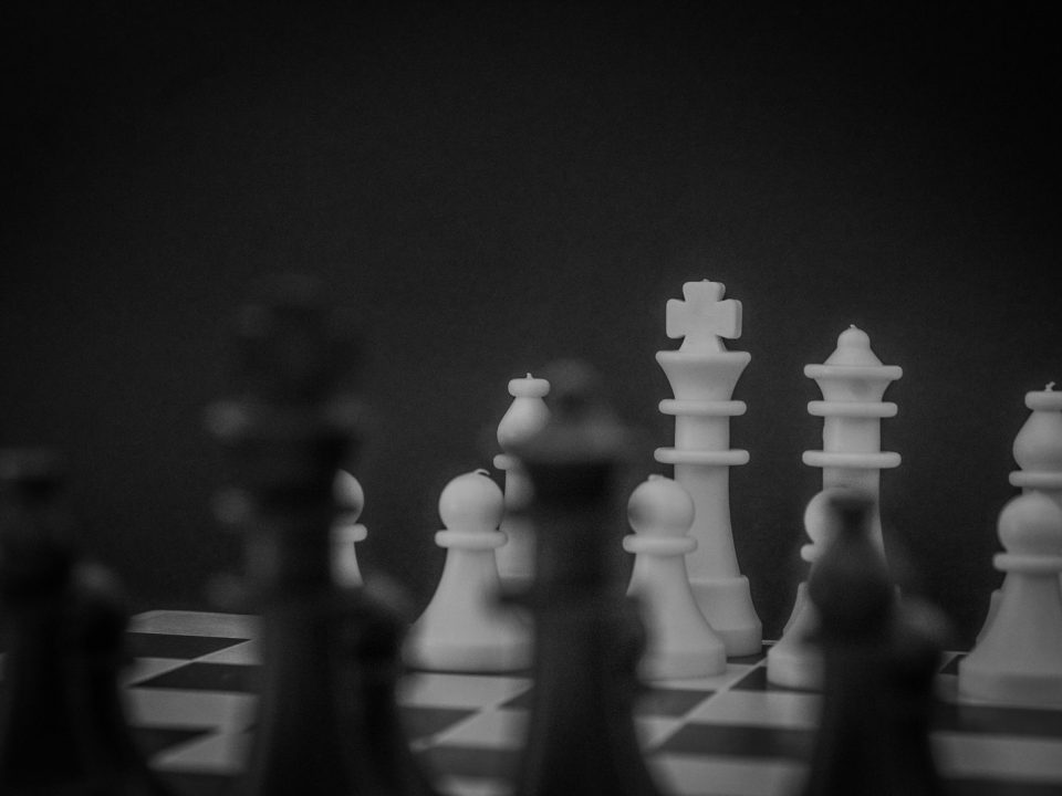 grayscale photo of a chess set