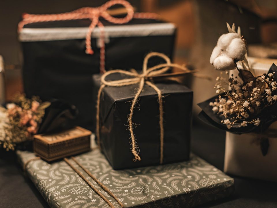 black and brown gift box on white and black floral textile