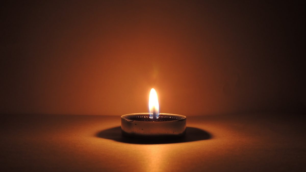 round ceramic bowl with lighted candle