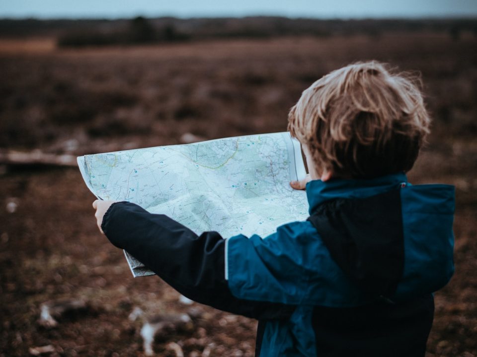 child looking at map