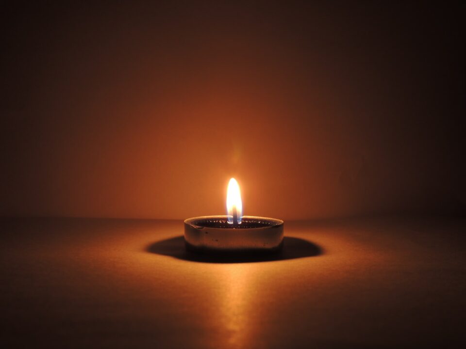 round ceramic bowl with lighted candle