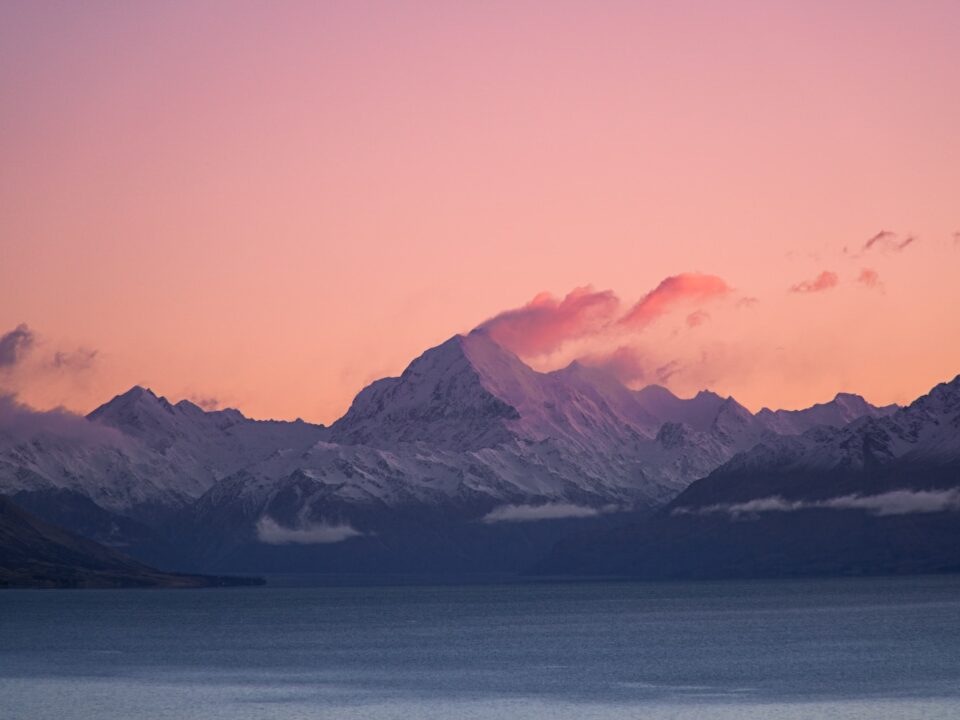 a view of a mountain range at sunset