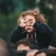 girl making hand gesture on her face