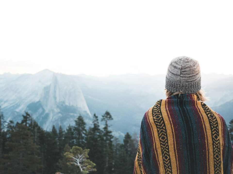 woman facing the mountains at daytime