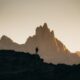 a person standing on top of a rocky hill