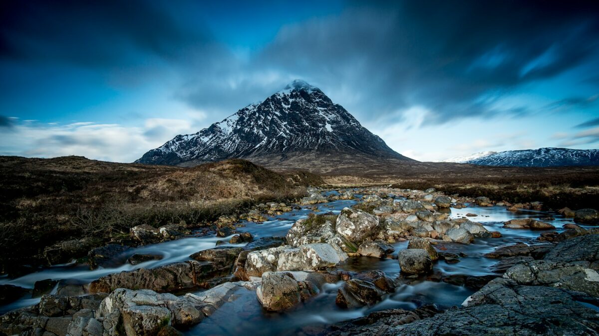 body of water at the foot of mountain