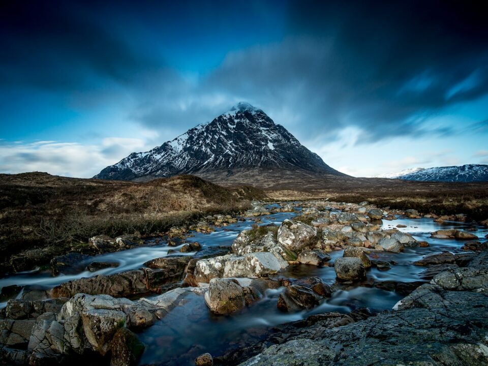 body of water at the foot of mountain