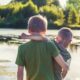 boy in green t-shirt standing beside boy in green t-shirt