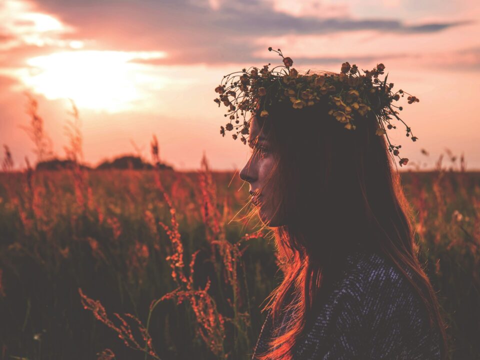 depth photography of woman with flower headpiece