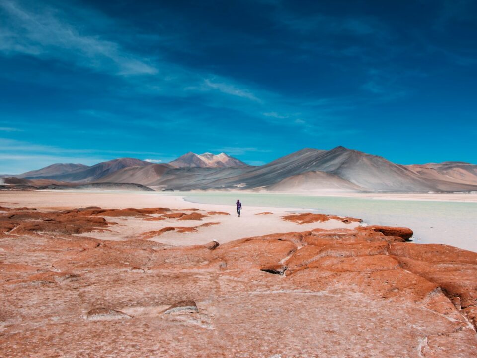 person walking in distance of mountain