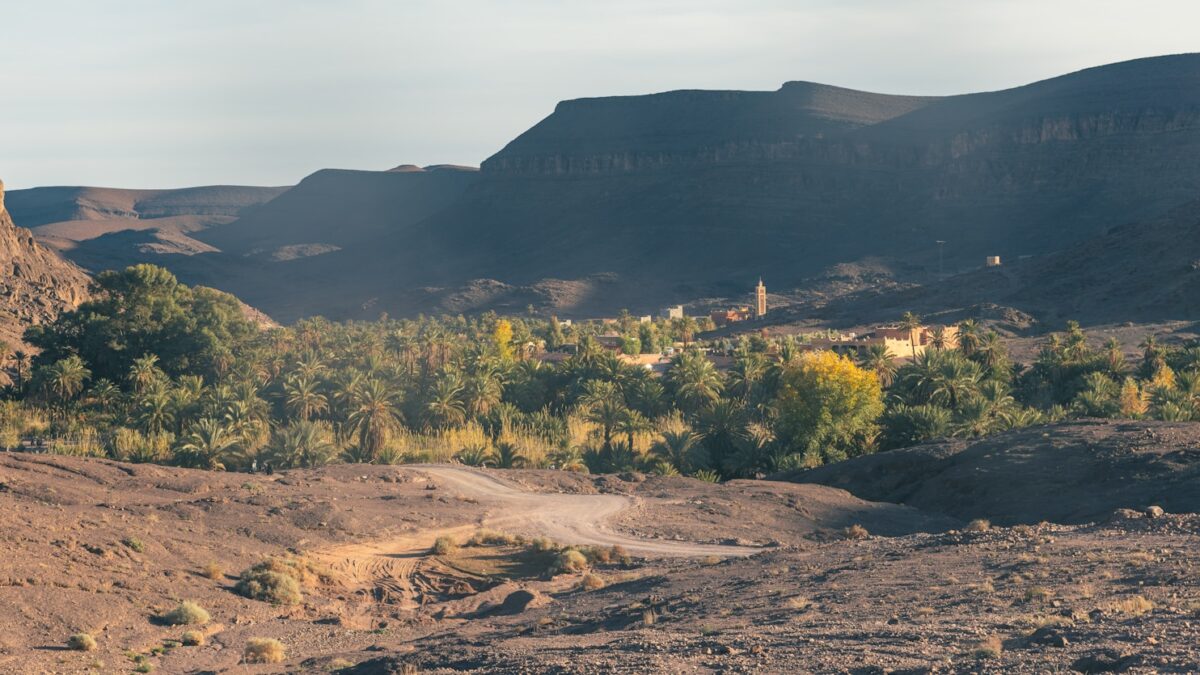 a dirt road in the middle of a mountain range