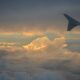 a view of the wing of an airplane in the sky