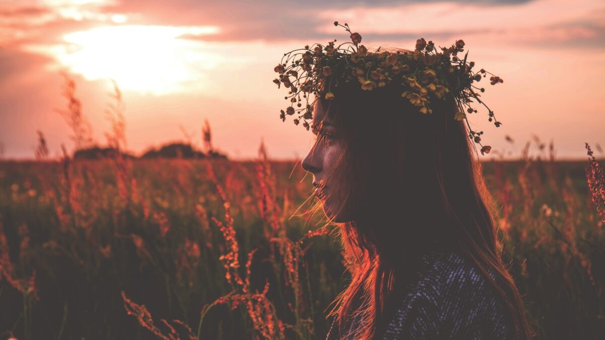 depth photography of woman with flower headpiece