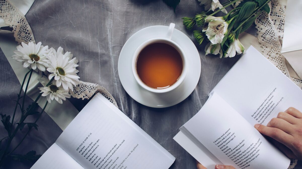 white cup with saucer near bok