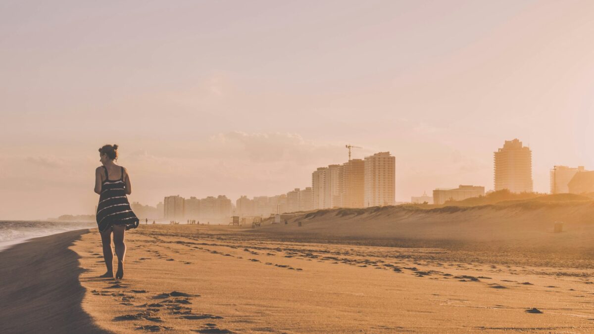 woman walking on desert sand