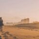 woman walking on desert sand