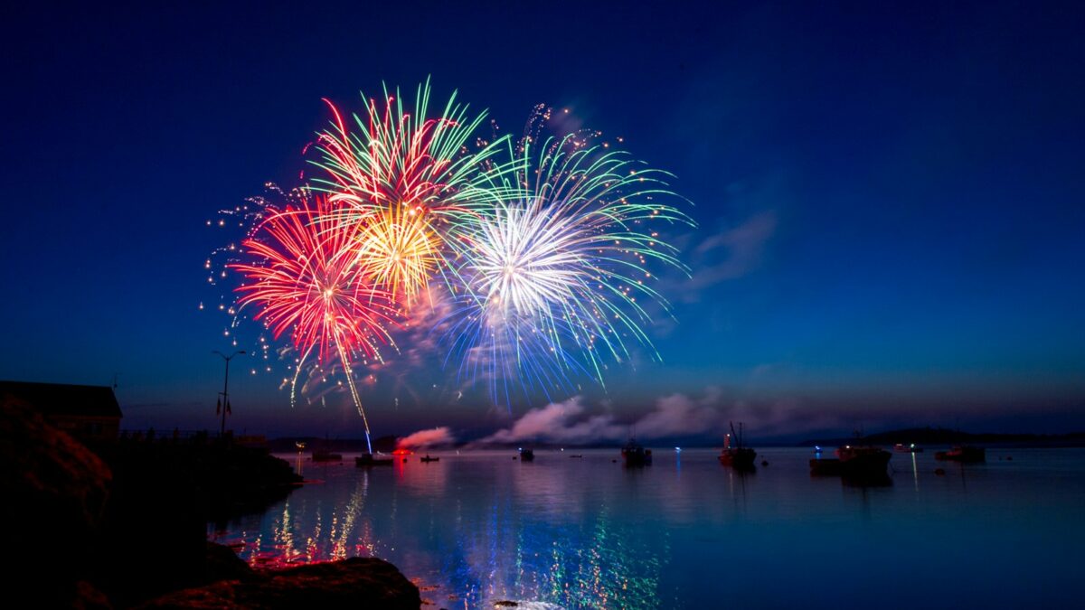 green, red, and white fireworks on sky at nighttime