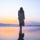 woman standing on beachfront