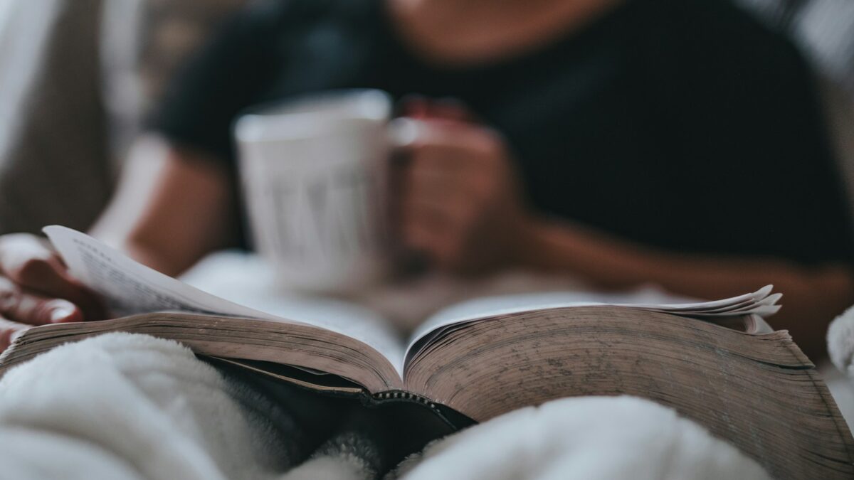 person holding coffee mug