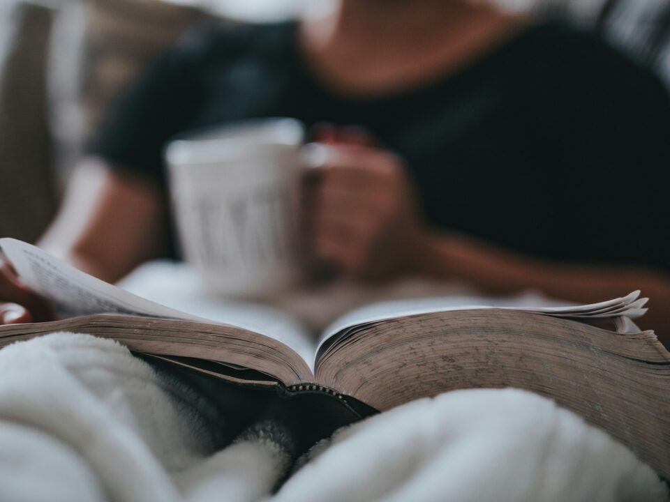 person holding coffee mug