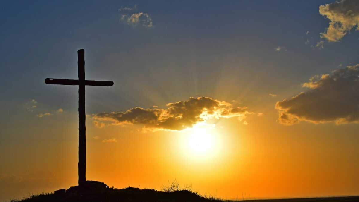 silhouette of cross during sunset