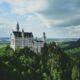 white concrete castle in green field