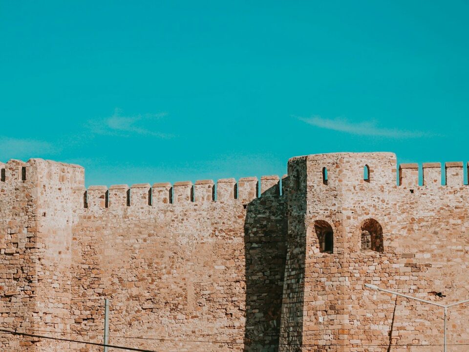 brown brick building under blue sky during daytime