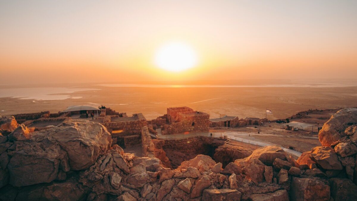 brown rock formation during sunset
