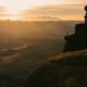 Golden sunset over a vast canyon landscape