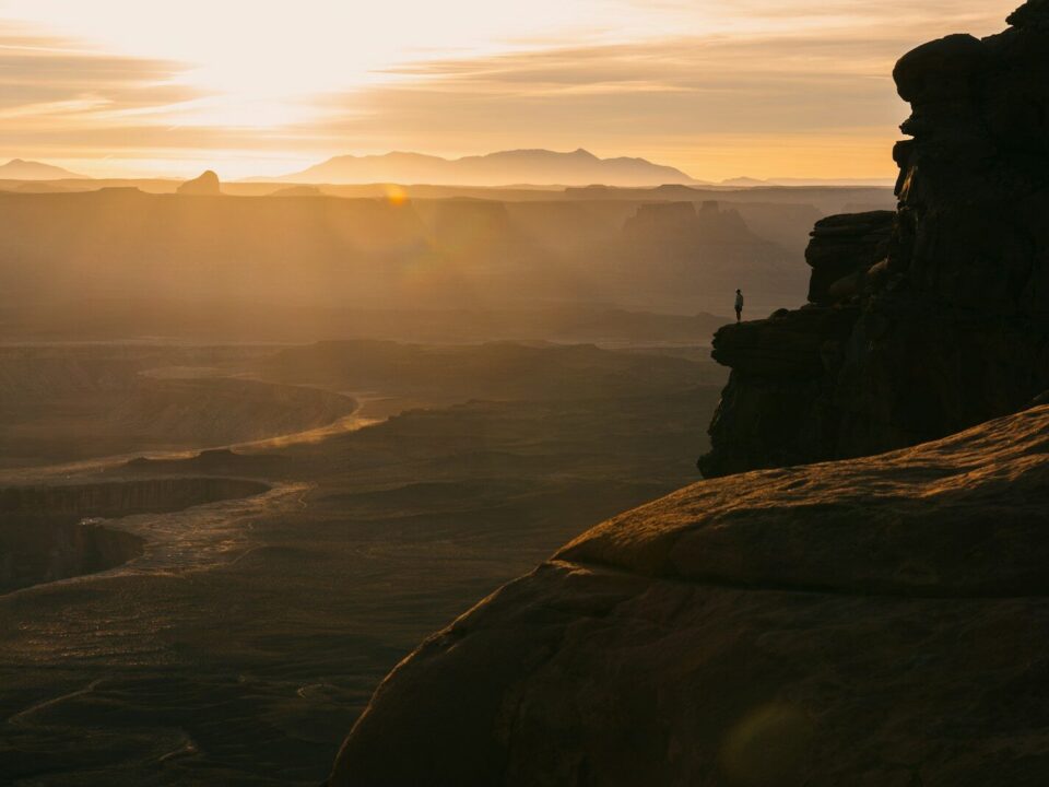 Golden sunset over a vast canyon landscape