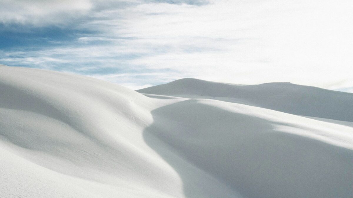 desert under white clouds during daytime