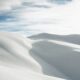 desert under white clouds during daytime