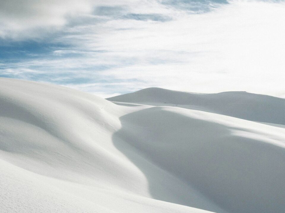 desert under white clouds during daytime