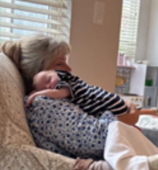Anne, “Nana Puddin,” holding baby Ezekiel asleep on her shoulder